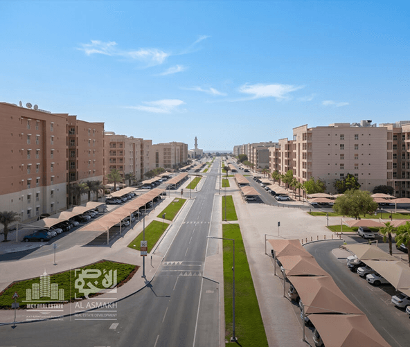 Aerial view of a landscaped residential street in Mesaimeer City